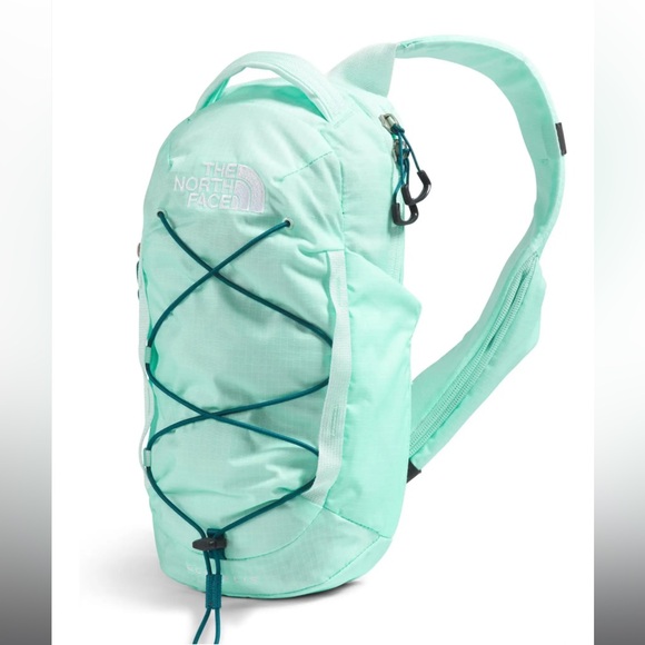 The North Face Handbags - Crater aqua/blue moss borealis sling. North face bag.